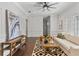 Bright living room featuring hardwood floors, comfy seating, and large artwork at 9832 Laurel Valley Dr, Windermere, FL 34786