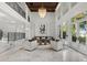 Spacious living room with a high ceiling, large windows, and lake views at 9832 Laurel Valley Dr, Windermere, FL 34786