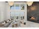 Lakefront living room with a marble fireplace and high ceilings at 9832 Laurel Valley Dr, Windermere, FL 34786