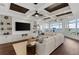 Bright living room features a large sectional sofa, water views, and a built-in entertainment center at 9832 Laurel Valley Dr, Windermere, FL 34786