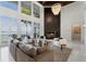 Living area with a marble fireplace and expansive lake views at 9832 Laurel Valley Dr, Windermere, FL 34786