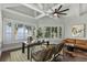 Lake view office with hardwood floors, built-in shelving, and large windows at 9832 Laurel Valley Dr, Windermere, FL 34786