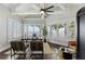 Lake view office with hardwood floors, built-in shelving, and large windows at 9832 Laurel Valley Dr, Windermere, FL 34786