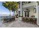 Outdoor patio with seating, lake views, and grilling station at 9832 Laurel Valley Dr, Windermere, FL 34786