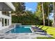 Inviting pool area with lounge chairs and lush landscaping at 9832 Laurel Valley Dr, Windermere, FL 34786