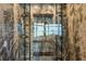 Elegant wine cellar with glass-front storage and marble walls at 9832 Laurel Valley Dr, Windermere, FL 34786