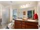 Double vanity bathroom with large mirror and shower at 31 Diamond Ridge Way, Ocala, FL 34472
