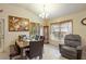 Bright dining area with seating for six and large window at 31 Diamond Ridge Way, Ocala, FL 34472