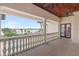 Balcony overlooking lake with pool and lush landscape at 16716 Artimino Loop, Montverde, FL 34756