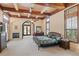Luxurious main bedroom with fireplace and ample natural light at 16716 Artimino Loop, Montverde, FL 34756