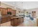 Modern kitchen with island and granite countertops at 16716 Artimino Loop, Montverde, FL 34756