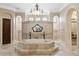 Elegant Primary bathroom with soaking tub, walk-in shower, and dual vanities at 16716 Artimino Loop, Montverde, FL 34756