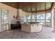 Covered outdoor kitchen with lake views at 16716 Artimino Loop, Montverde, FL 34756