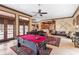 Relaxing game room with pool table and access to backyard at 16716 Artimino Loop, Montverde, FL 34756