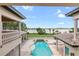 Stunning pool and spa overlooking a lake from a home's balcony at 16716 Artimino Loop, Montverde, FL 34756