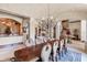 Formal dining room with a large table and chandelier at 16716 Artimino Loop, Montverde, FL 34756