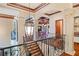 Elegant staircase with wrought iron railing and chandelier at 16716 Artimino Loop, Montverde, FL 34756
