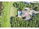 Bird's-eye view of house, pool and landscape at 16716 Artimino Loop, Montverde, FL 34756