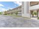 Exterior view of condo building with walkway and landscaping at 700 Melrose Ave # E4, Winter Park, FL 32789