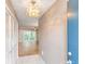 Condo entryway with tiled floor, closet, and view of living room at 700 Melrose Ave # E4, Winter Park, FL 32789