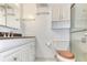 Clean bathroom with white vanity, shower, and shelving at 700 Melrose Ave # E4, Winter Park, FL 32789