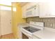 View of kitchen with built-in microwave and range at 700 Melrose Ave # E4, Winter Park, FL 32789