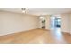 Living room with wood floors and open layout to kitchen at 700 Melrose Ave # E4, Winter Park, FL 32789