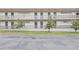 Exterior view of condo building with balconies and landscaping at 700 Melrose Ave # E4, Winter Park, FL 32789
