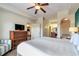 Main bedroom with king bed and en-suite bathroom at 8125 Resort Village Dr # 5405, Orlando, FL 32821