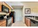 Modern kitchen with black appliances and granite countertops at 8125 Resort Village Dr # 5405, Orlando, FL 32821
