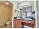 Guest bathroom with double vanity and toilet at 8125 Resort Village Dr # 5405, Orlando, FL 32821