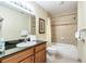 Bathroom with tub, granite vanity, and shower at 8125 Resort Village Dr # 5405, Orlando, FL 32821