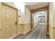 Residential hallway with carpeted floors and arched doorways at 8125 Resort Village Dr # 5405, Orlando, FL 32821