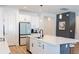 Modern kitchen with white cabinets, stainless steel appliances, and quartz countertops at 7904 Waterfield Ave # 1, Orlando, FL 32832