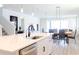 Modern kitchen with white cabinets, quartz countertops, and stainless steel appliances at 7904 Waterfield Ave # 1, Orlando, FL 32832