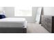 Comfortable bedroom with king-size bed and large window at 7904 Waterfield Ave # 1, Orlando, FL 32832