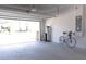 Attached garage with white brick walls and epoxy flooring at 7904 Waterfield Ave # 1, Orlando, FL 32832