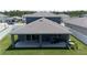 Home features a covered patio and spacious backyard at 7904 Waterfield Ave # 1, Orlando, FL 32832