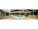 View of a kidney-shaped pool from a covered patio at 225 Se 30Th Ave, Ocala, FL 34471