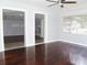 Spacious living room with hardwood floors and views into other rooms at 225 Se 30Th Ave, Ocala, FL 34471