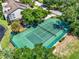 Private tennis court nestled within a wooded setting at 300 N Shadowbay Blvd # 206, Longwood, FL 32779