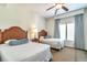 Cozy bedroom with two twin beds and ample natural light at 8125 Resort Village Dr # 5509, Orlando, FL 32821