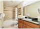 Clean bathroom with a shower/tub combo and granite vanity at 8125 Resort Village Dr # 5509, Orlando, FL 32821