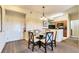 Small dining area with glass table and four chairs at 8125 Resort Village Dr # 5509, Orlando, FL 32821