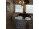 Bright dining room with glass-top table at 24650 Fox Rd, Astor, FL 32102