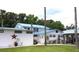Home with multiple buildings and lush landscaping at 24650 Fox Rd, Astor, FL 32102
