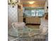 Eat-in kitchen with white cabinets and appliances at 24650 Fox Rd, Astor, FL 32102