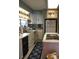 Well-equipped kitchen with white cabinets and a breakfast bar at 24650 Fox Rd, Astor, FL 32102