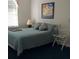 Bedroom with double bed and artwork at 24650 Fox Rd, Astor, FL 32102