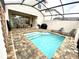 Private screened-in pool and patio area with lounge chairs at 2178 Cooper Bell Pl, Kissimmee, FL 34747
